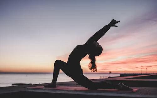 yoga pose beach sunrise